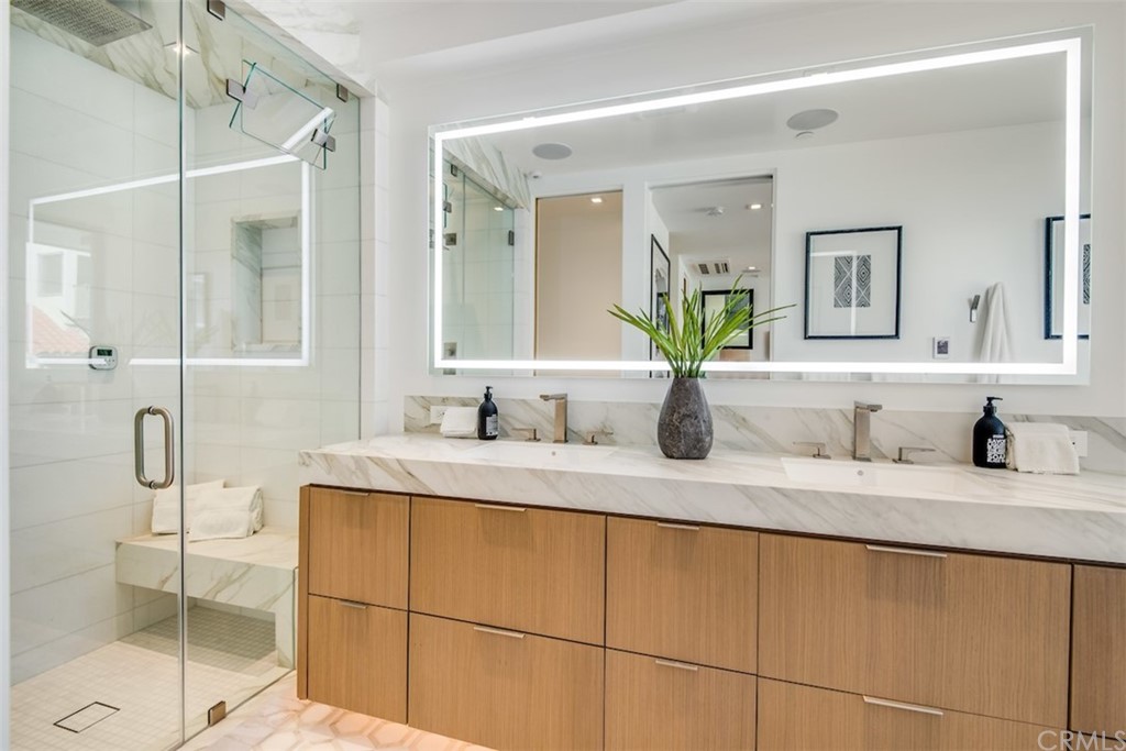 200 40th Street Manhattan Beach, CA 90266 - Photo 32 of 57 a bathroom with a granite countertop sink and a mirror