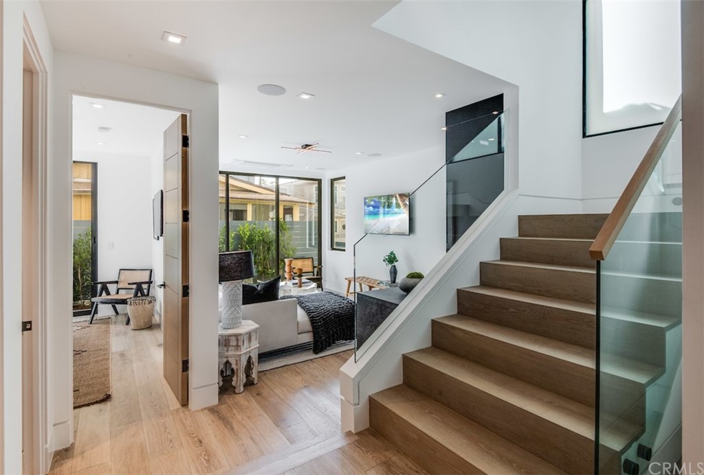 200 40th Street Manhattan Beach, CA 90266 - Photo 35 of 57 a living room with furniture and a potted plant