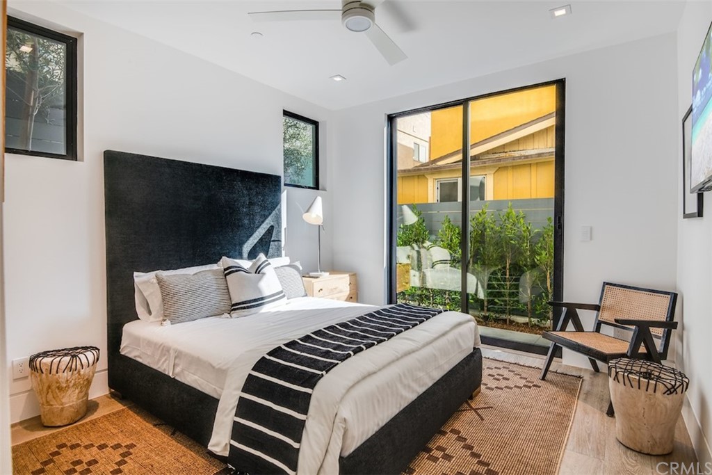 200 40th Street Manhattan Beach, CA 90266 - Photo 37 of 57 a bedroom with bed and glass door