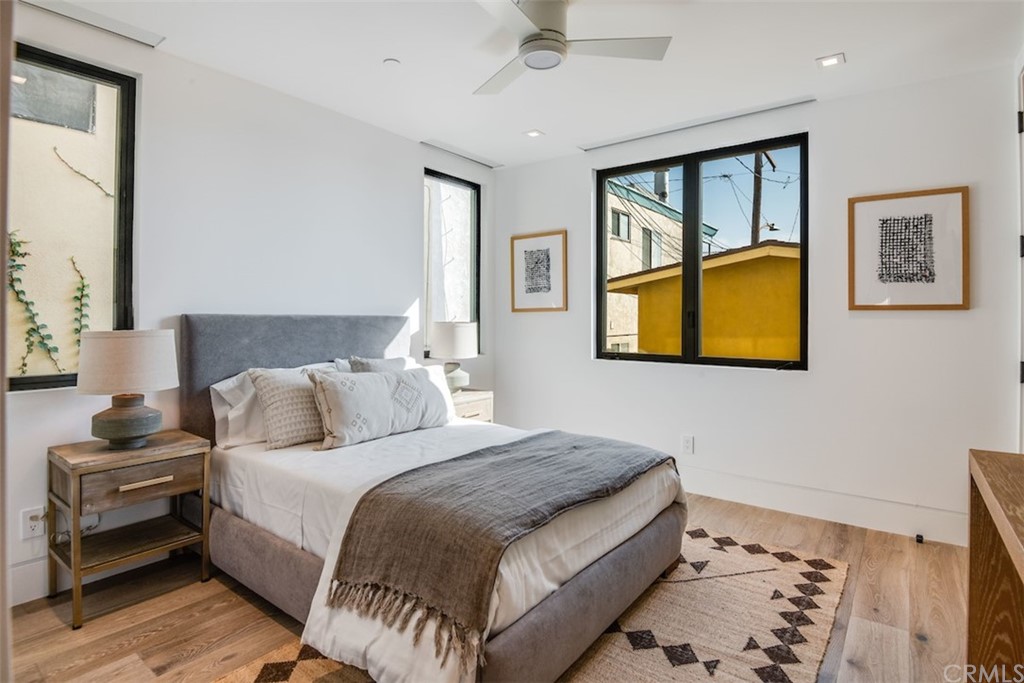 200 40th Street Manhattan Beach, CA 90266 - Photo 39 of 57 a bedroom with a bed and a painting on the wall