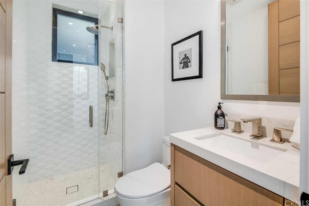 200 40th Street Manhattan Beach, CA 90266 - Photo 41 of 57 a bathroom with a sink a toilet and shower