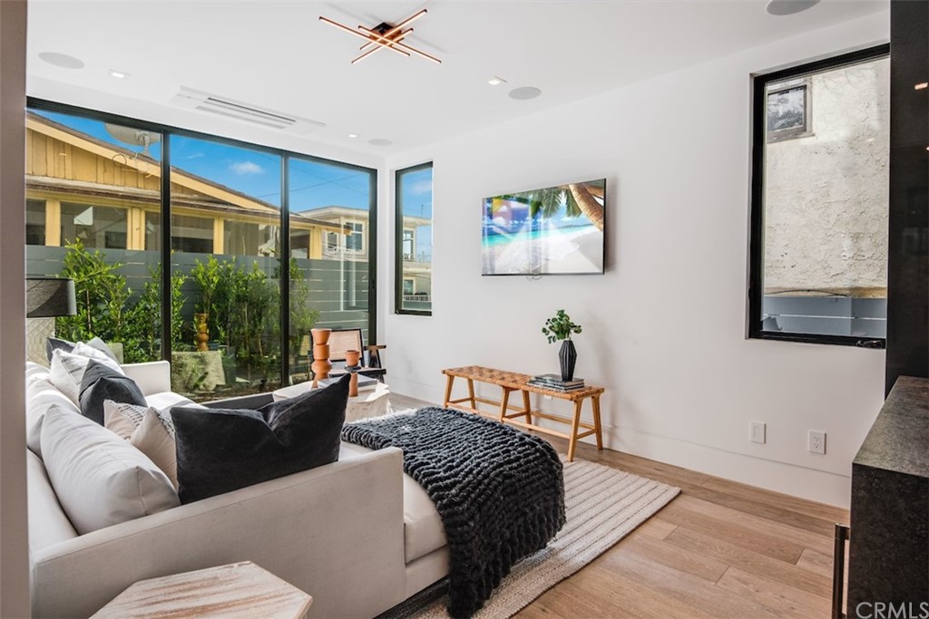200 40th Street Manhattan Beach, CA 90266 - Photo 42 of 57 a living room with furniture and a window