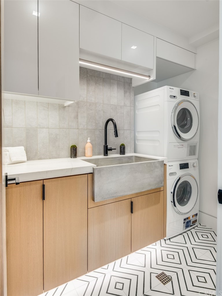 200 40th Street Manhattan Beach, CA 90266 - Photo 45 of 57 a kitchen with a sink a stove and cabinets