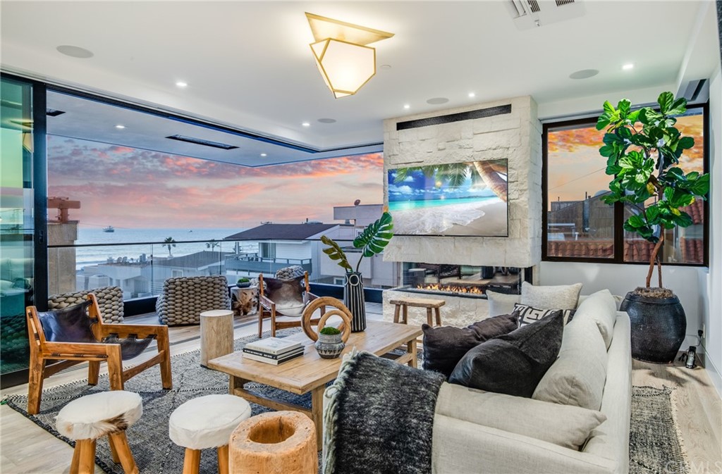200 40th Street Manhattan Beach, CA 90266 - Photo 52 of 57 a living room with furniture and a large window