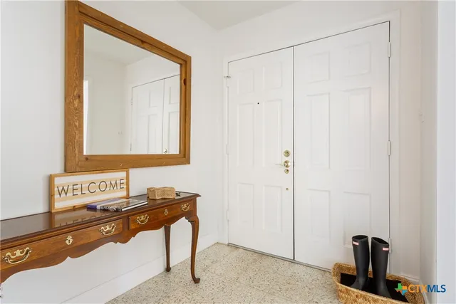 a view of a dining room with furniture window and chandelier