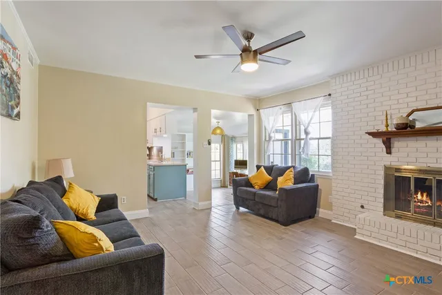 a bathroom with a toilet a sink and a window