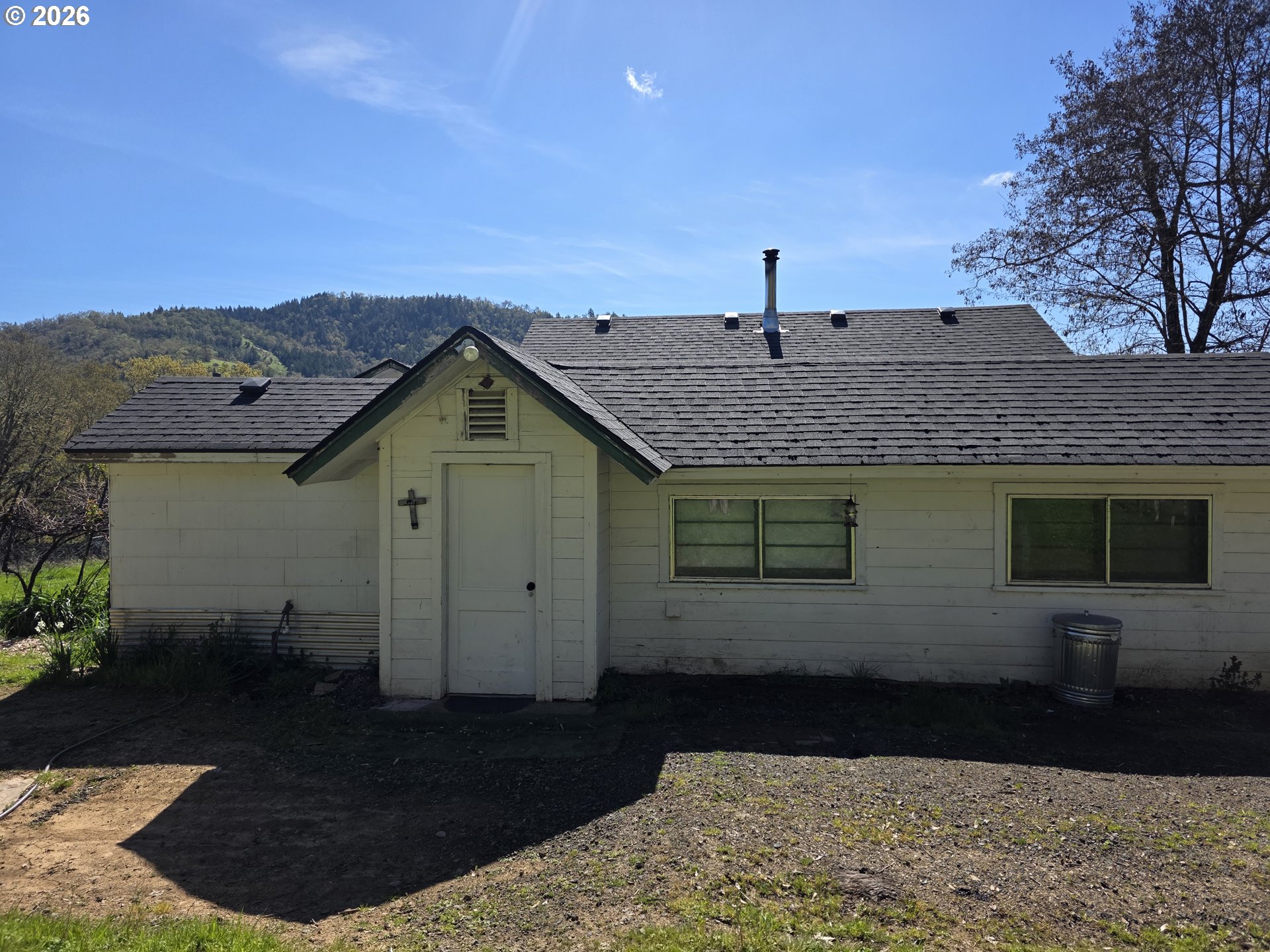 4341 Happy Valley Road Roseburg, OR 97471 - Photo 4 of 18 a front view of a house with a yard