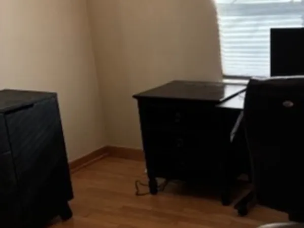 a view of entryway with wooden floor