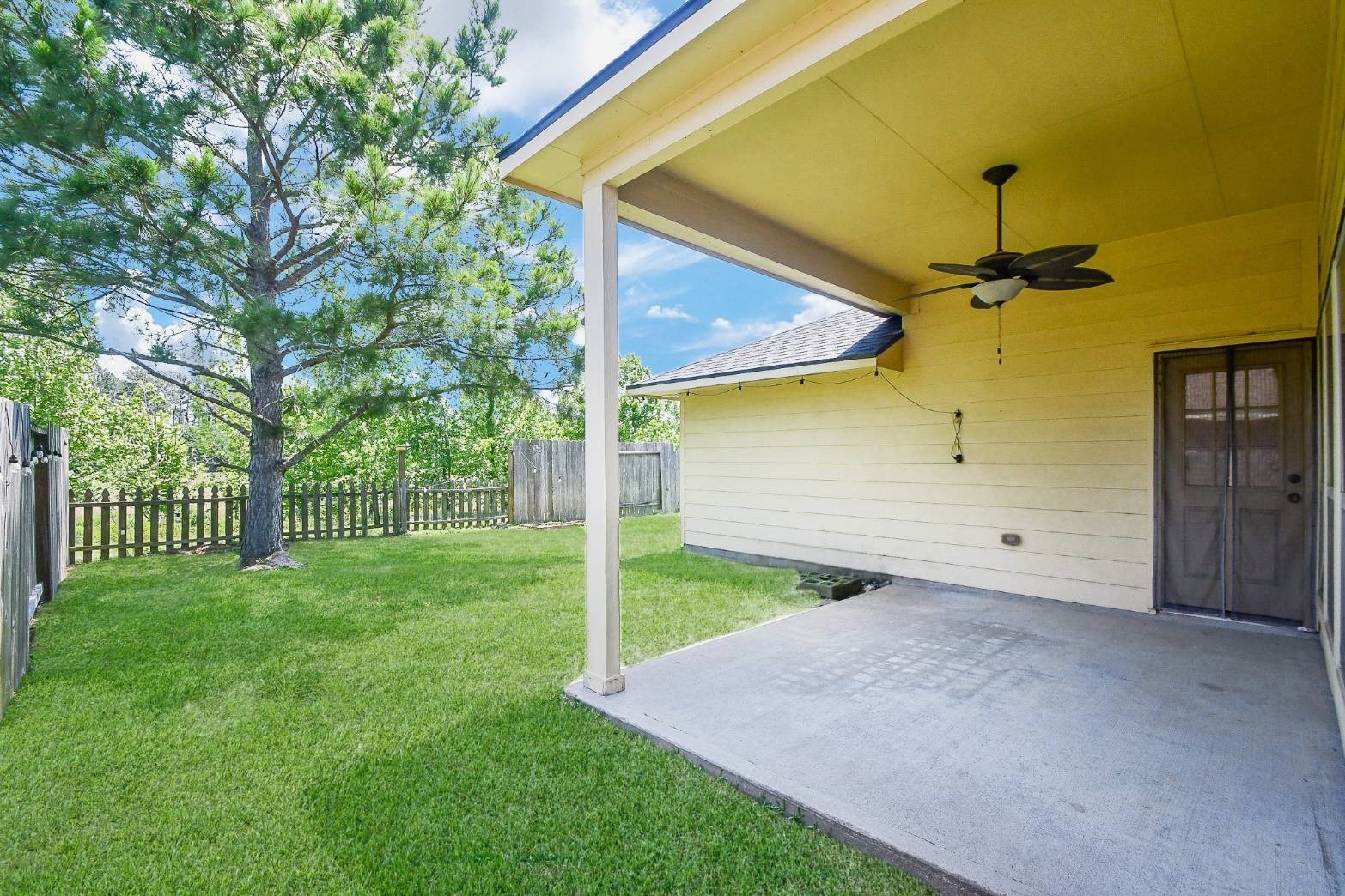 16814 Ranger Ridge Drive Cypress, TX 77429 - Photo 34 of 42 Private backyard with a covered patio, nestled among mature trees and no rear neighbors.