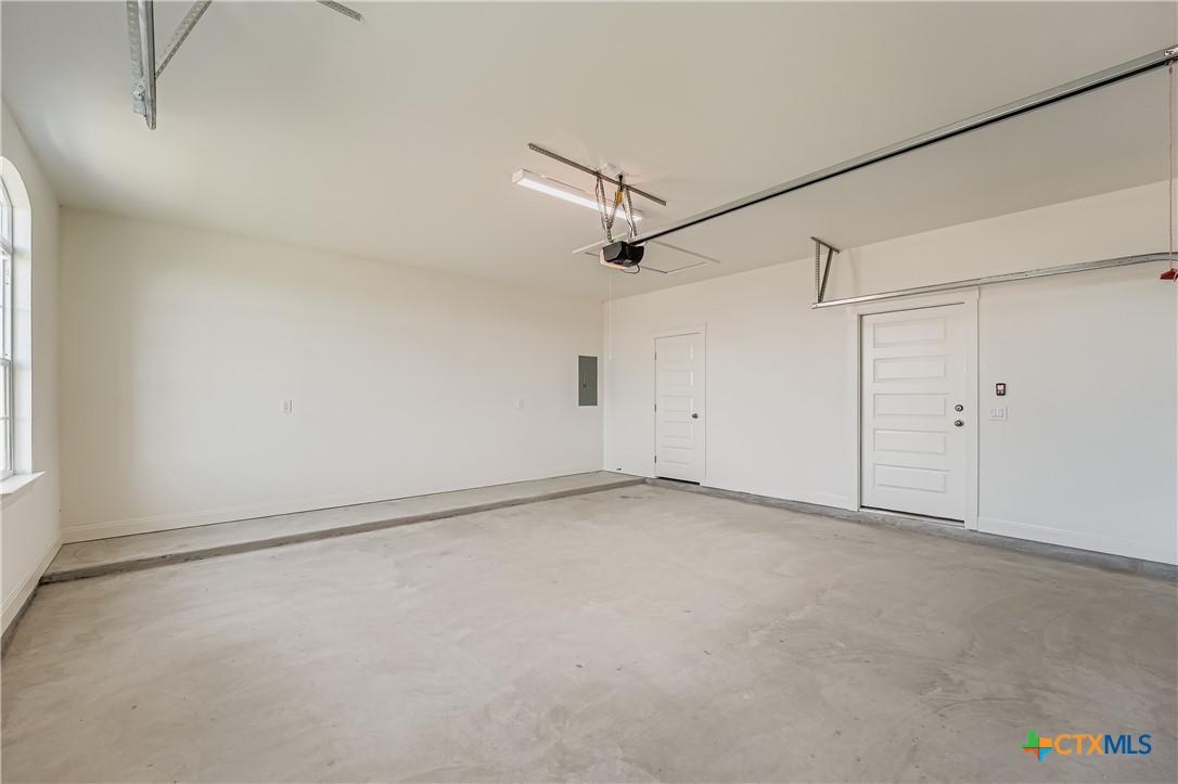 222 Arosa Drive Elgin, TX 78621 - Photo 36 of 40 an empty room with a ceiling fan and window