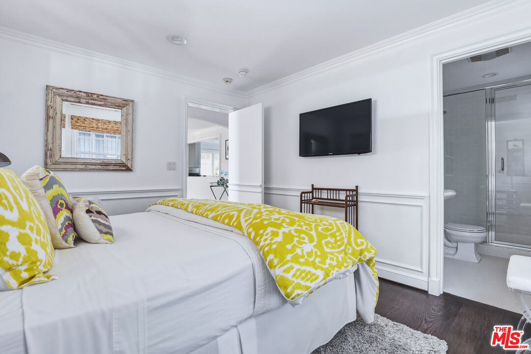 30810 Broad Beach Road Malibu, CA 90265 - Photo 46 of 55 a bedroom with a bed and a flat screen tv