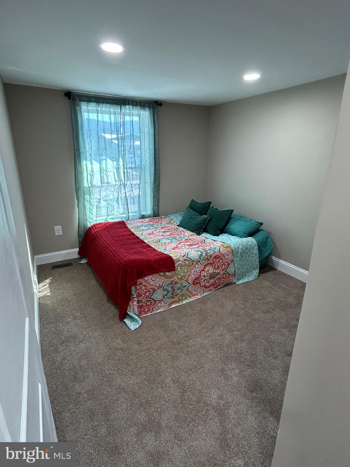 10763 Path Valley Road Fannettsburg, PA 17221 - Photo 13 of 35 a bed sitting in a room next to a window