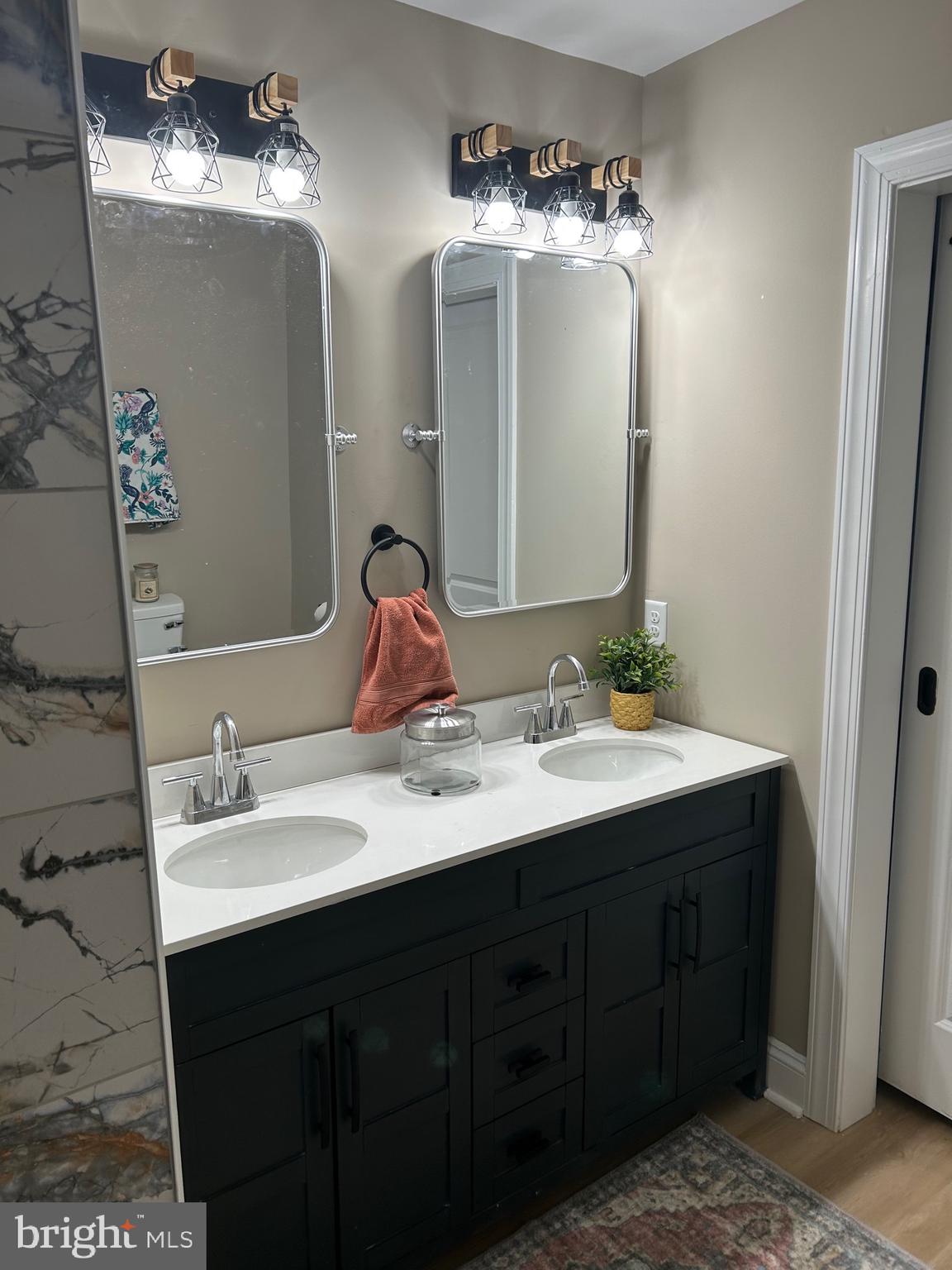 10763 Path Valley Road Fannettsburg, PA 17221 - Photo 35 of 35 a bathroom with a double vanity sink and a mirror