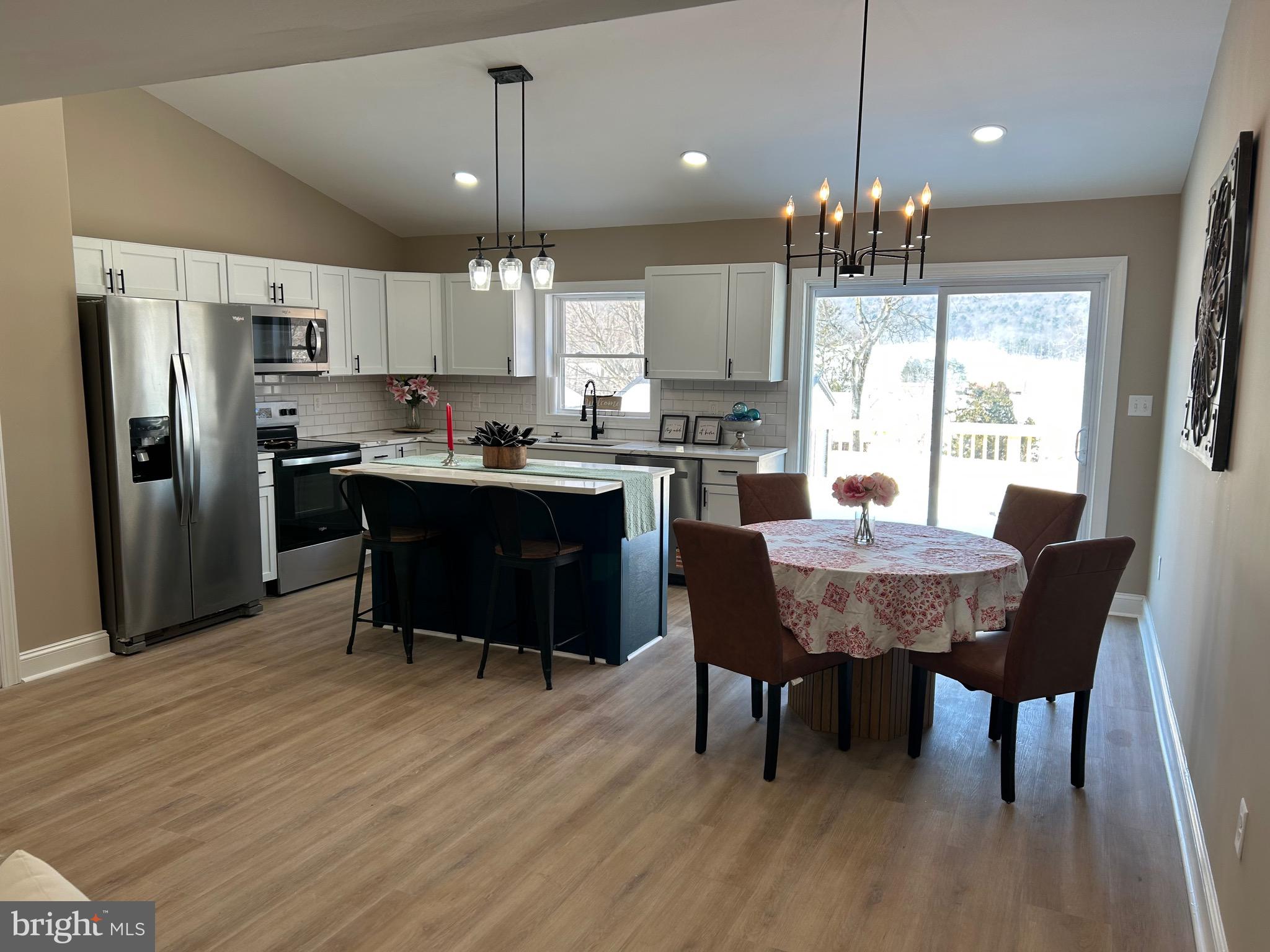 10763 Path Valley Road Fannettsburg, PA 17221 - Photo 6 of 35 a view of a dining room with furniture window and wooden floor