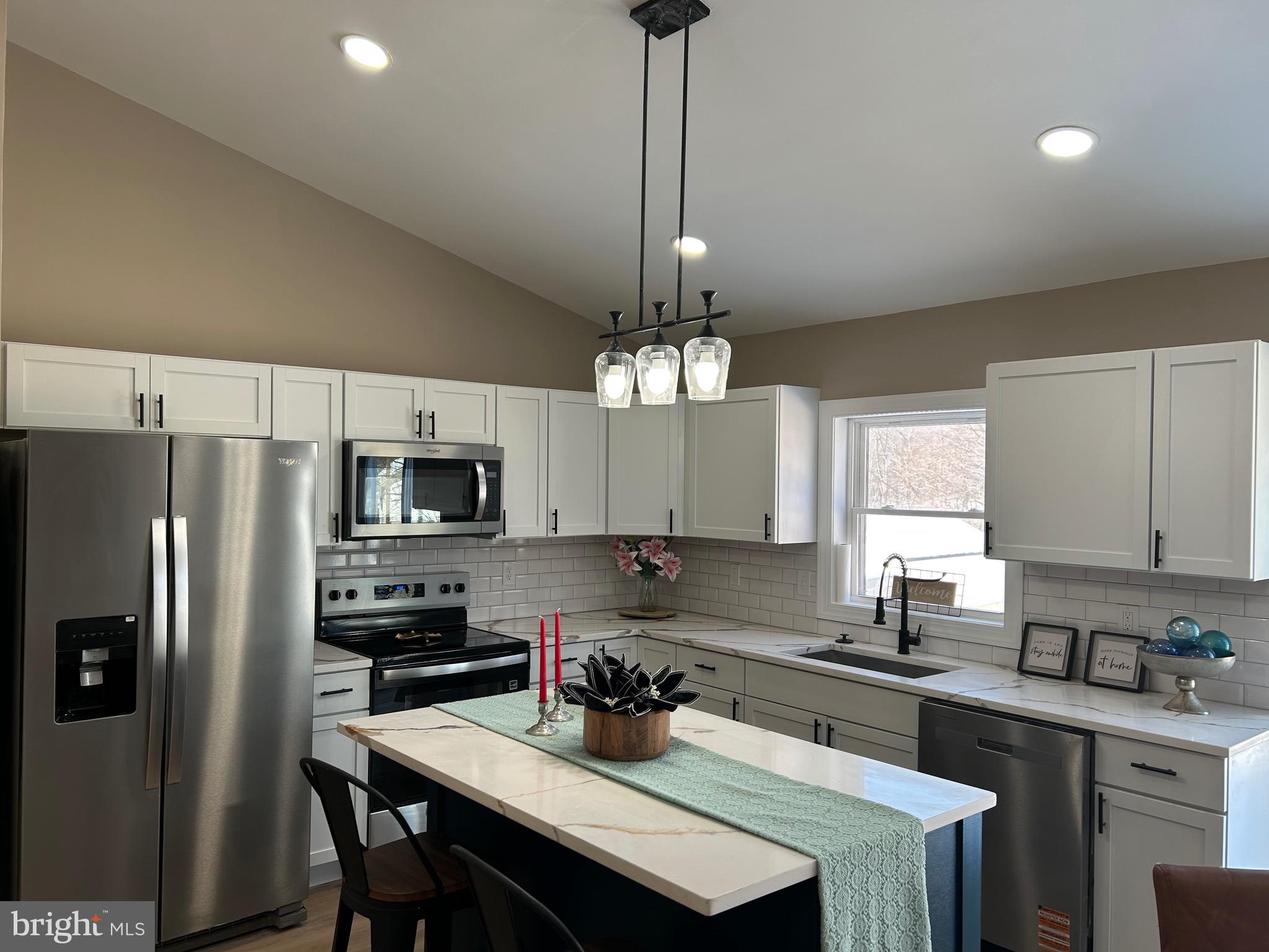 10763 Path Valley Road Fannettsburg, PA 17221 - Photo 7 of 35 a kitchen with a center island and stainless steel appliances