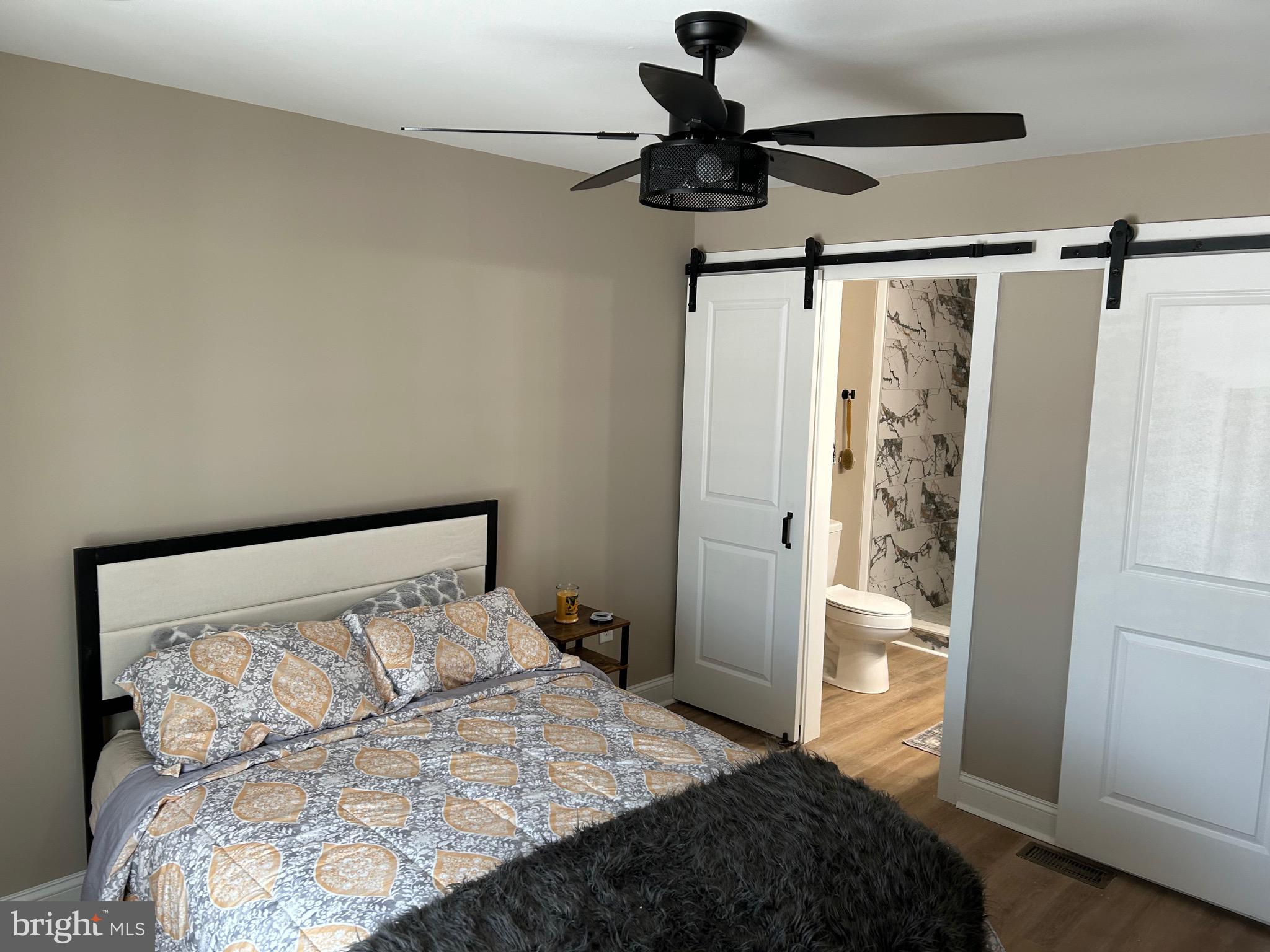 10763 Path Valley Road Fannettsburg, PA 17221 - Photo 9 of 35 a bedroom with a bed and a walk in closet