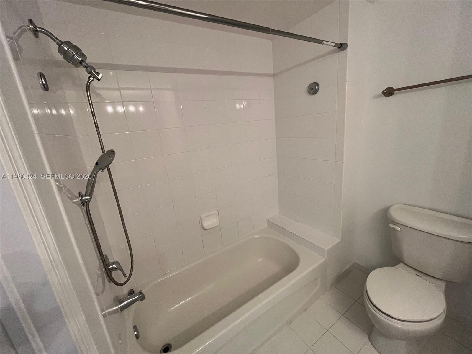 2030 Douglas Road, Unit 610 Coral Gables, FL 33134 - Photo 15 of 19 a bathroom with a toilet and a shower