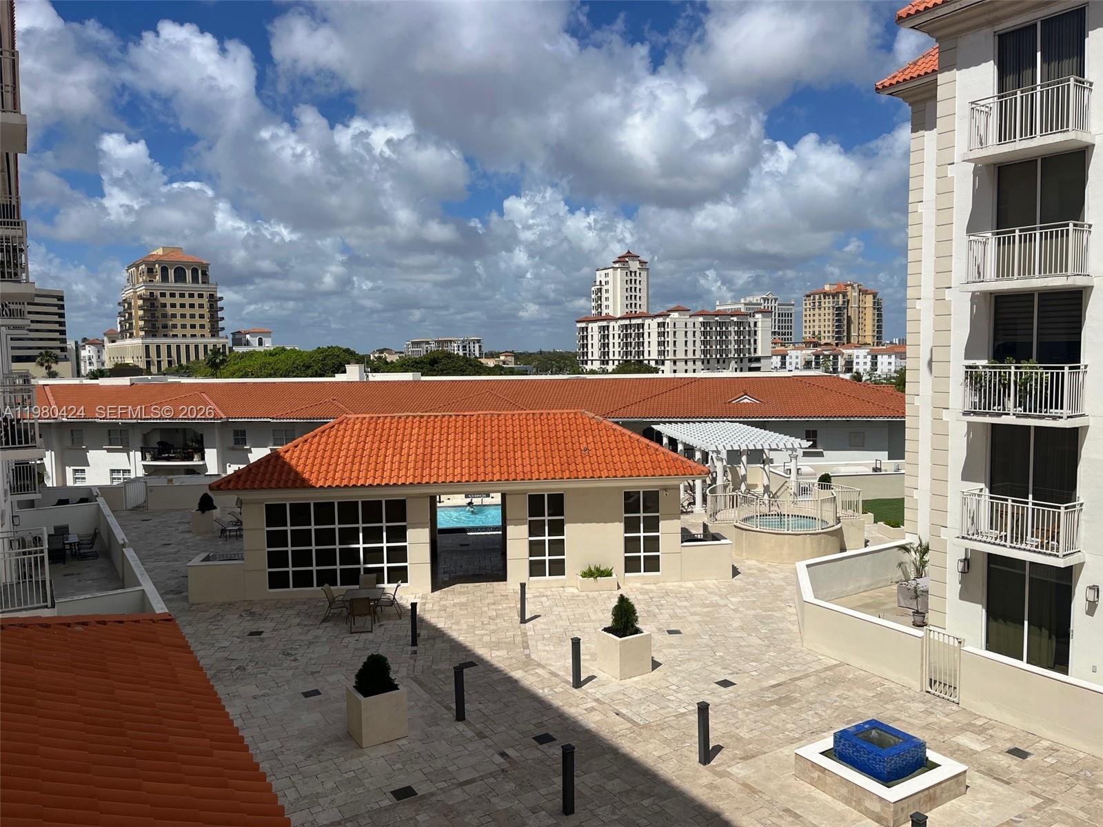 2030 Douglas Road, Unit 610 Coral Gables, FL 33134 - Photo 17 of 19 an outdoor space with pool and furniture