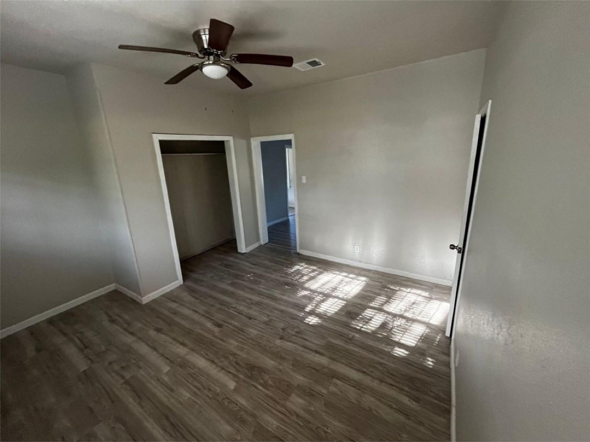 1648 West Rev Dr Ransom Howard Street Port Arthur, TX 77640 - Photo 12 of 12 a view of empty room with wooden floor