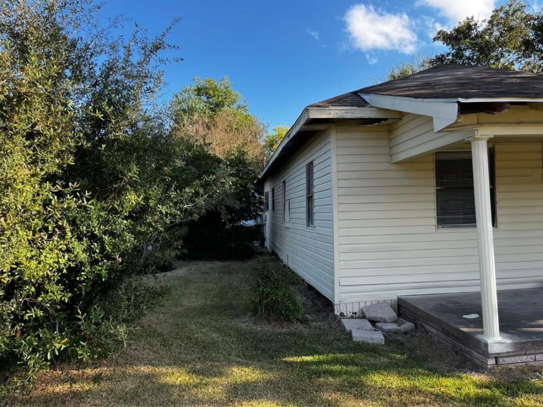 1648 West Rev Dr Ransom Howard Street Port Arthur, TX 77640 - Photo 2 of 12 a view of a house with a yard