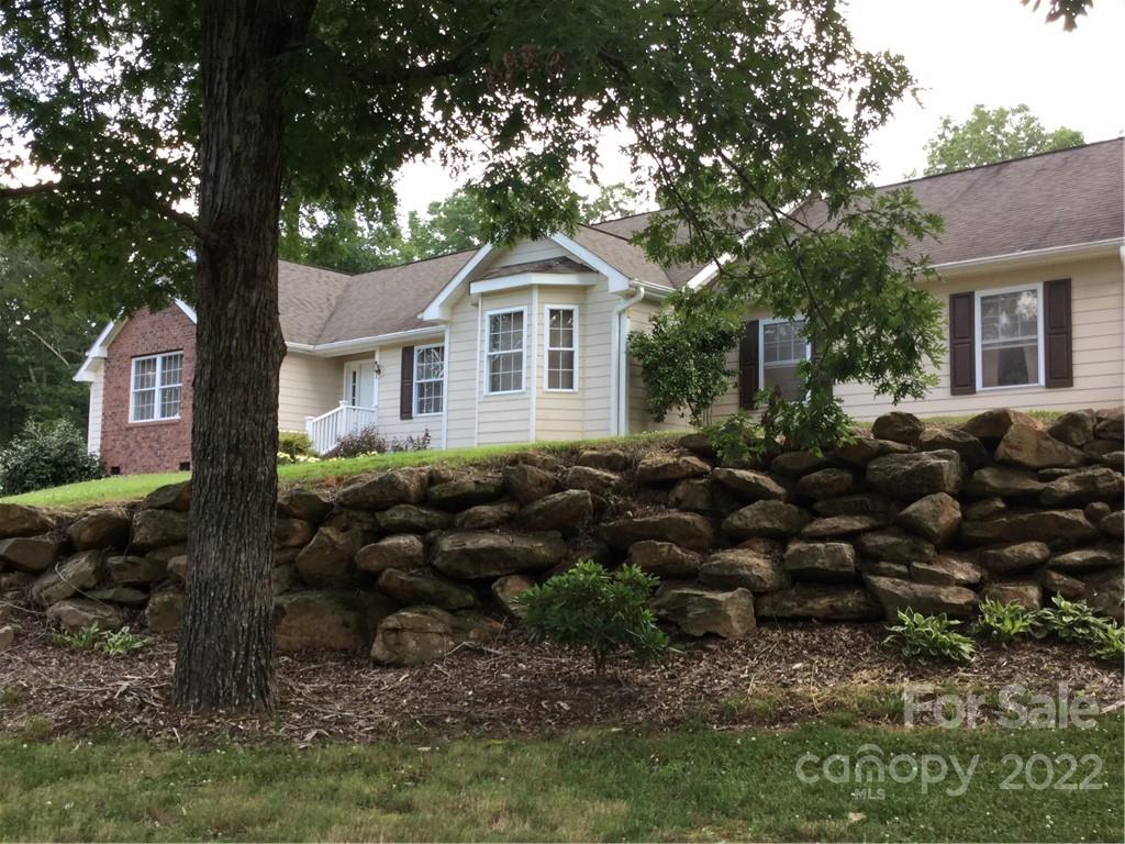 134 V S Dalton Road Rutherfordton, NC 28139 - Photo 1 of 43 a front view of a house with a garden