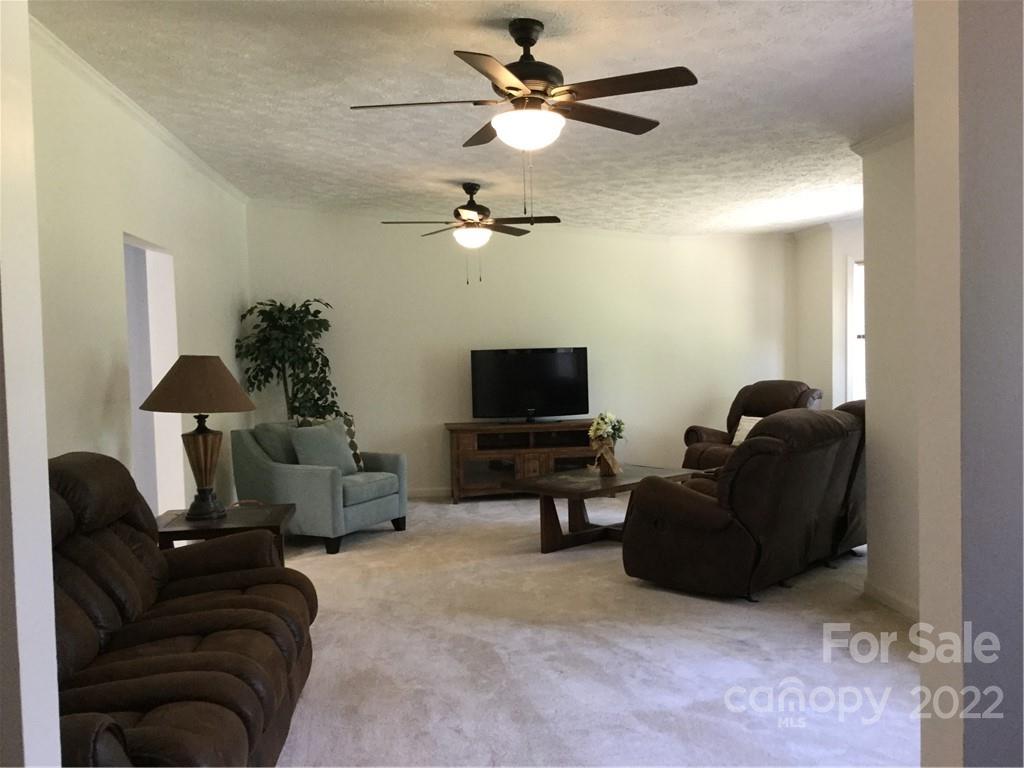 134 V S Dalton Road Rutherfordton, NC 28139 - Photo 17 of 43 a living room with furniture and a flat screen tv