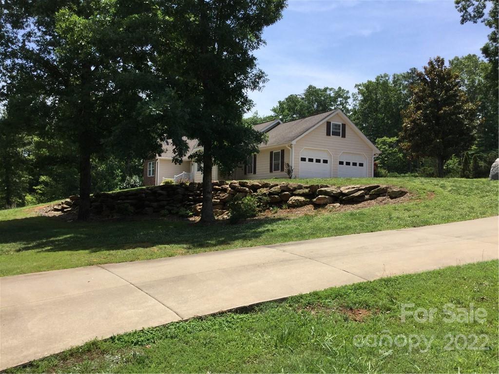 134 V S Dalton Road Rutherfordton, NC 28139 - Photo 2 of 43 a front view of a house with a yard and garage