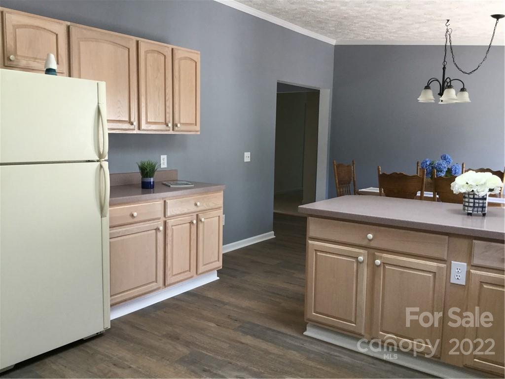 134 V S Dalton Road Rutherfordton, NC 28139 - Photo 22 of 43 a kitchen with stainless steel appliances granite countertop a refrigerator sink and white cabinets