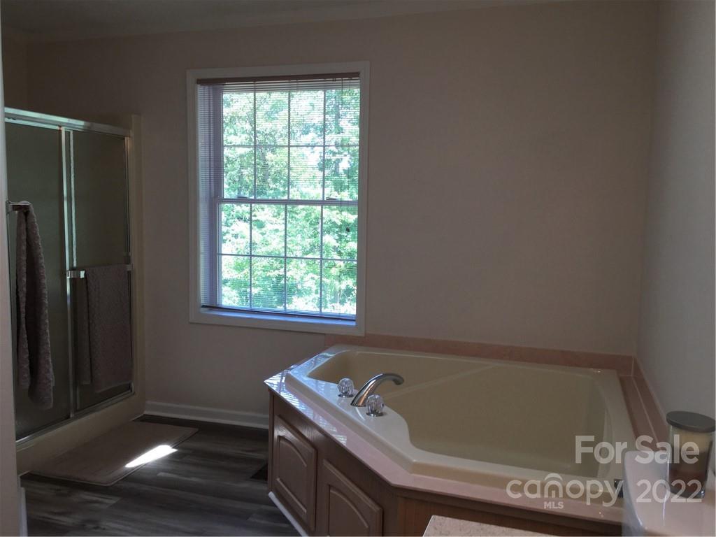 134 V S Dalton Road Rutherfordton, NC 28139 - Photo 28 of 43 a bathroom with a tub and a window