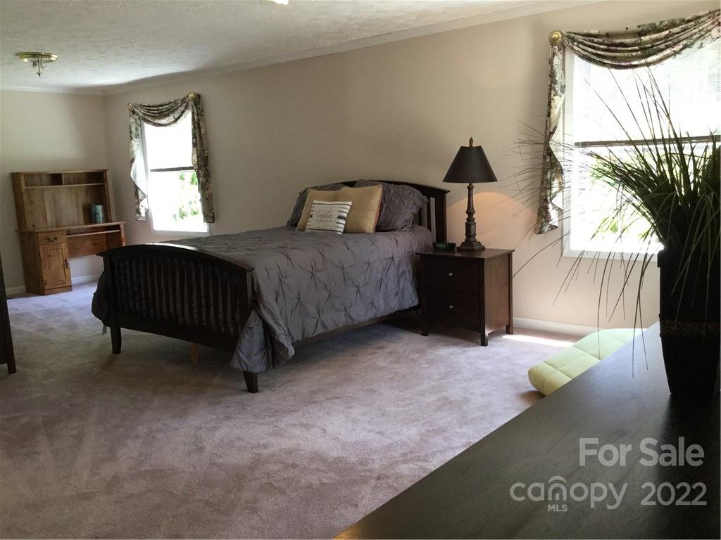 134 V S Dalton Road Rutherfordton, NC 28139 - Photo 33 of 43 a bedroom with a bed and window