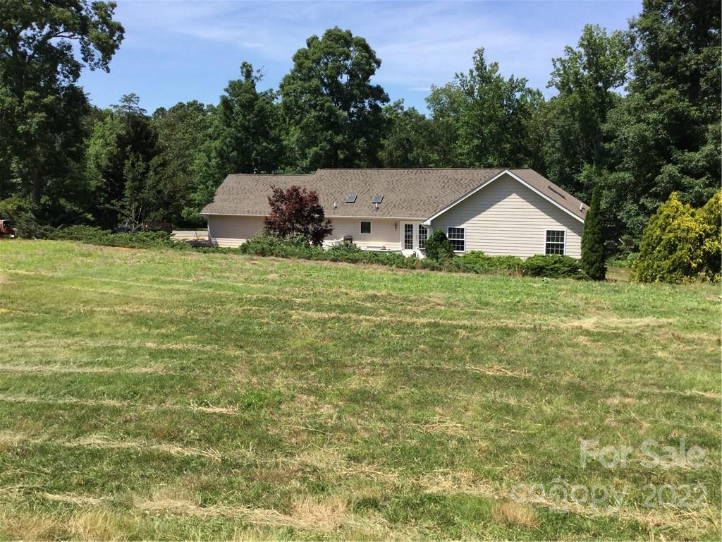 134 V S Dalton Road Rutherfordton, NC 28139 - Photo 5 of 43 a view of a house with a yard and potted plants