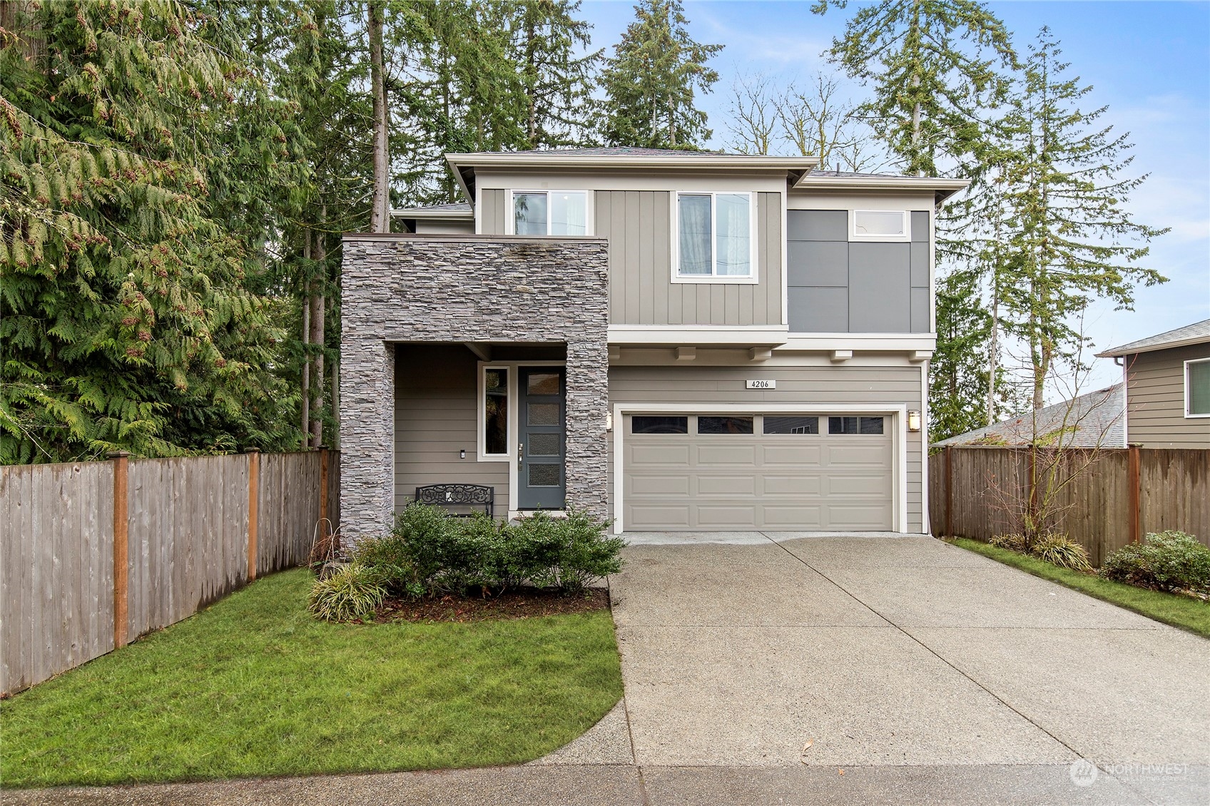 4206 223rd Place Southeast Bothell, WA 98021 - Photo 1 of 40 a front view of a house with a garden