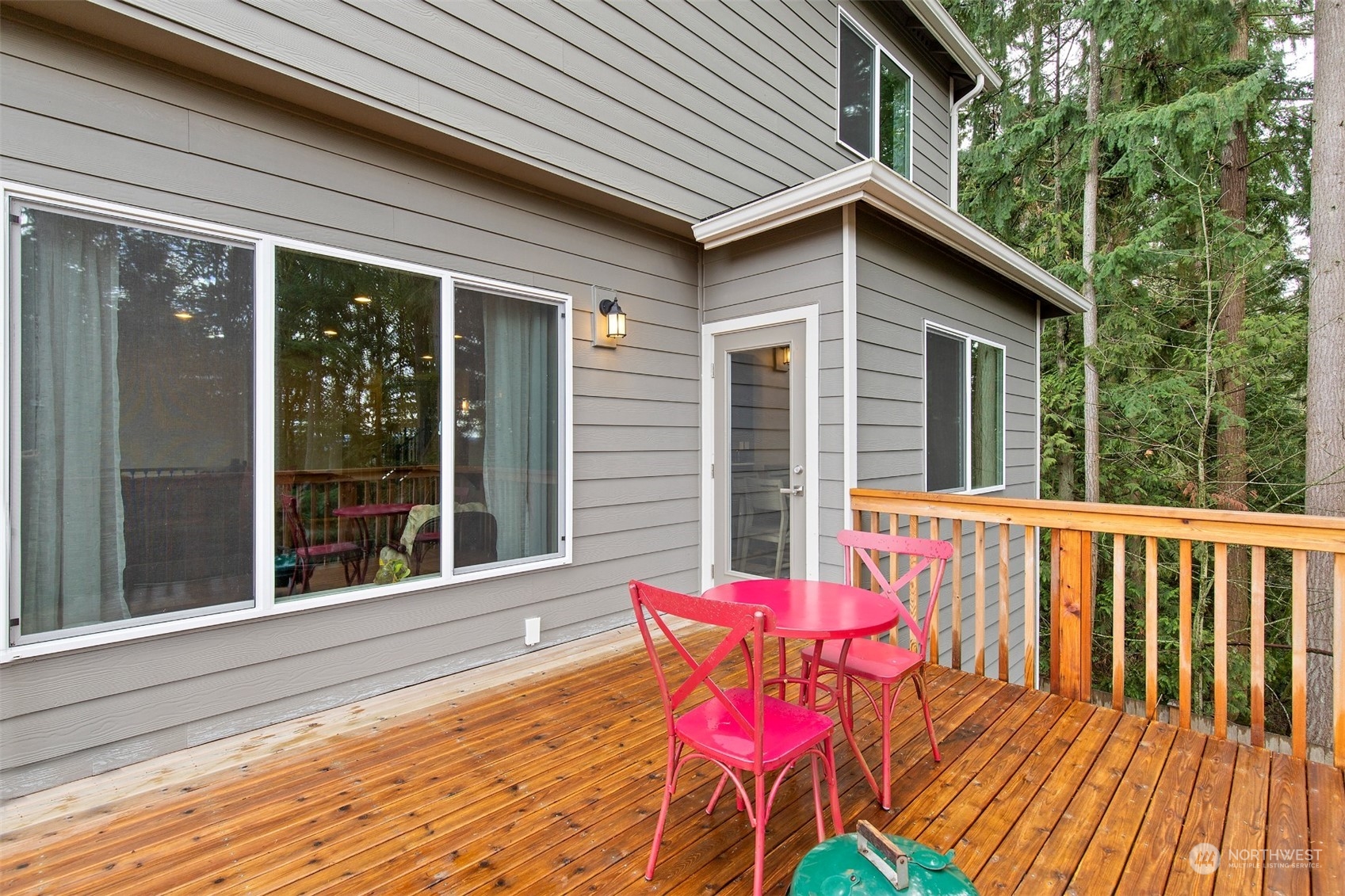 4206 223rd Place Southeast Bothell, WA 98021 - Photo 13 of 40 a view of a chair and table on the deck