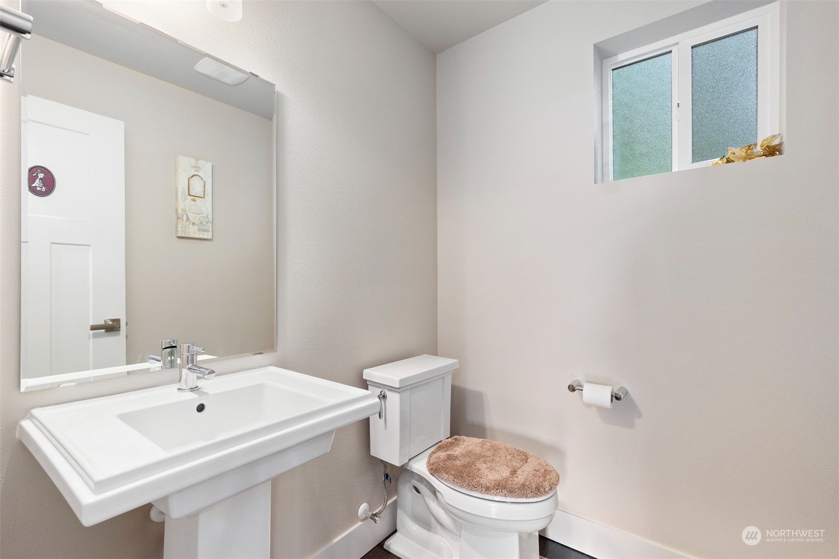4206 223rd Place Southeast Bothell, WA 98021 - Photo 14 of 40 a bathroom with a sink a toilet and mirror
