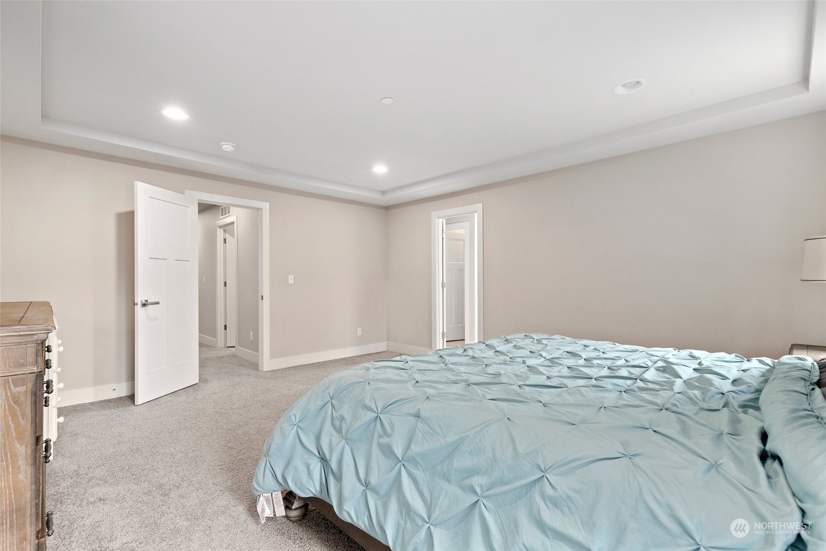 4206 223rd Place Southeast Bothell, WA 98021 - Photo 19 of 40 a spacious bedroom with a bed and a cabinets