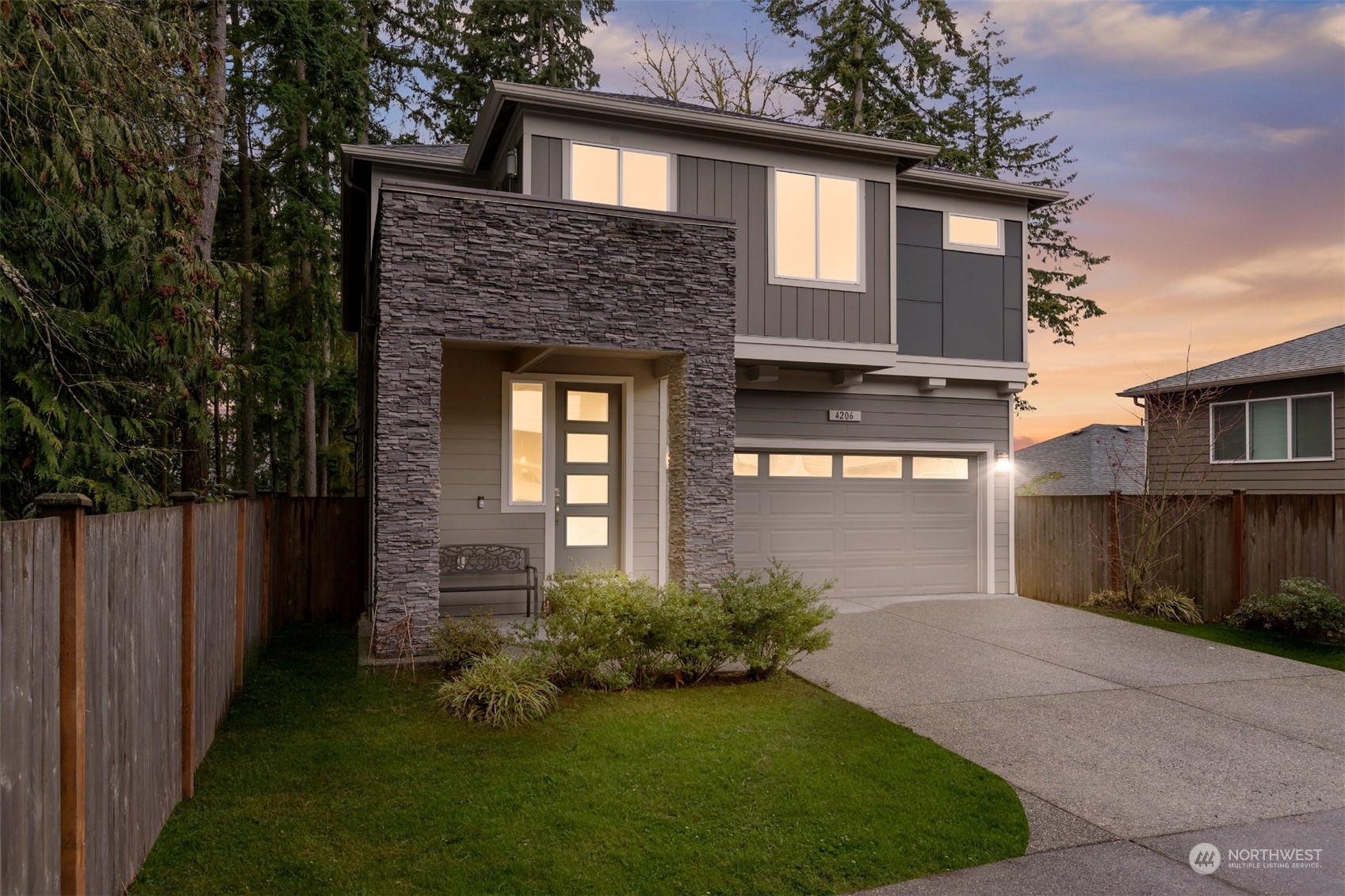 4206 223rd Place Southeast Bothell, WA 98021 - Photo 2 of 40 a front view of a house with garden