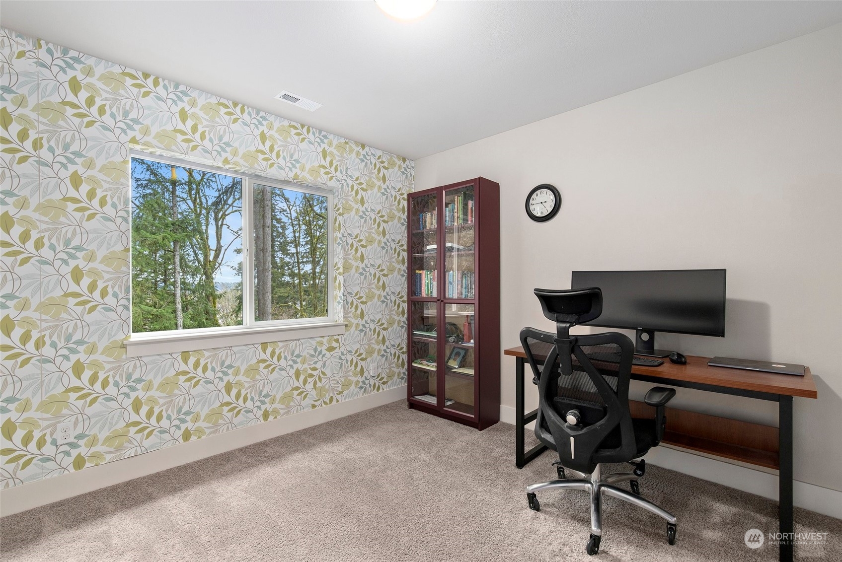 4206 223rd Place Southeast Bothell, WA 98021 - Photo 22 of 40 a view of a workspace with furniture and a window