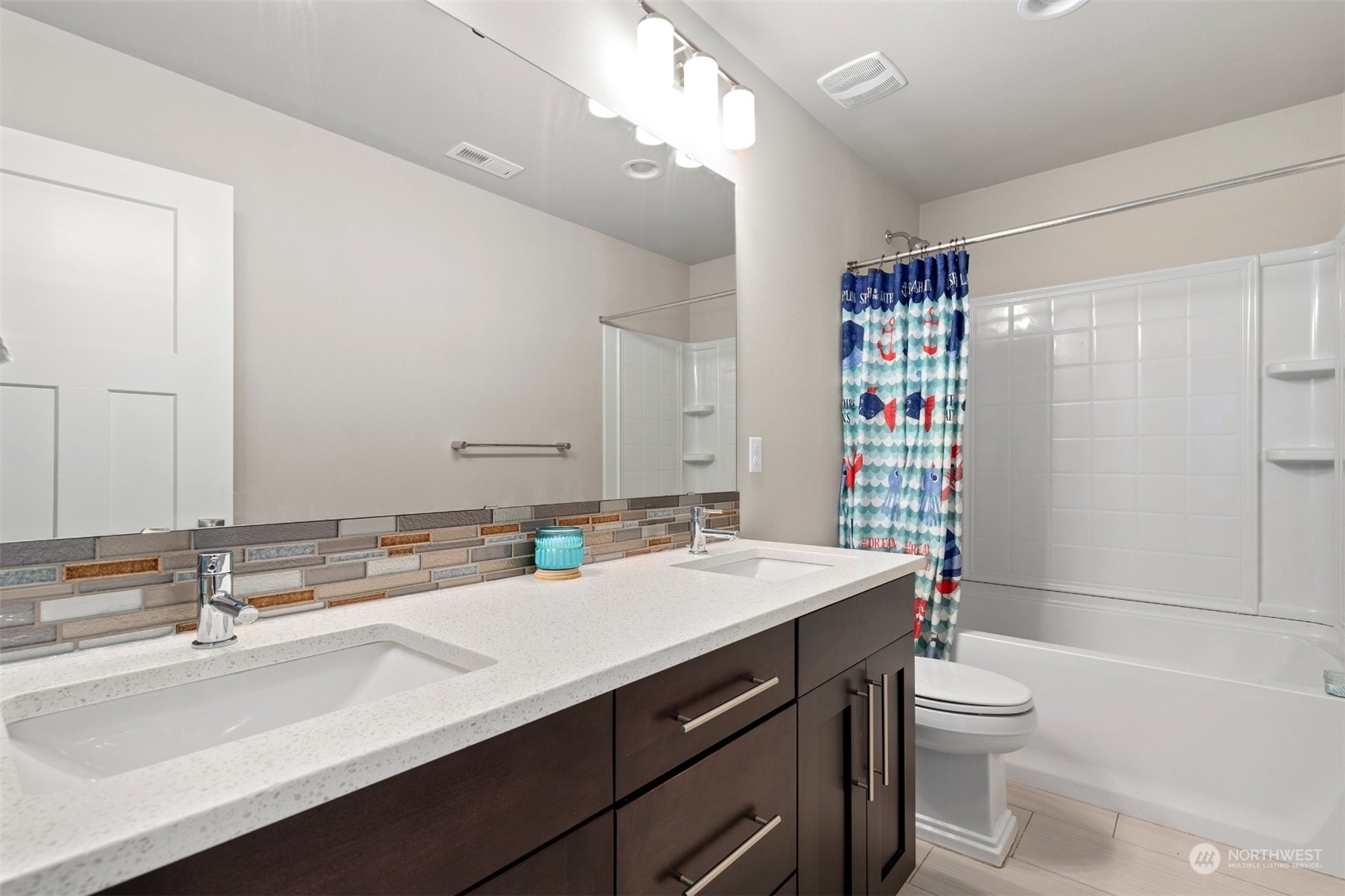 4206 223rd Place Southeast Bothell, WA 98021 - Photo 25 of 40 a bathroom with a sink a toilet and shower