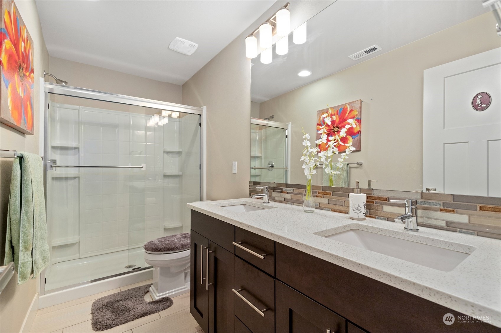 4206 223rd Place Southeast Bothell, WA 98021 - Photo 33 of 40 a bathroom with a sink a toilet and shower
