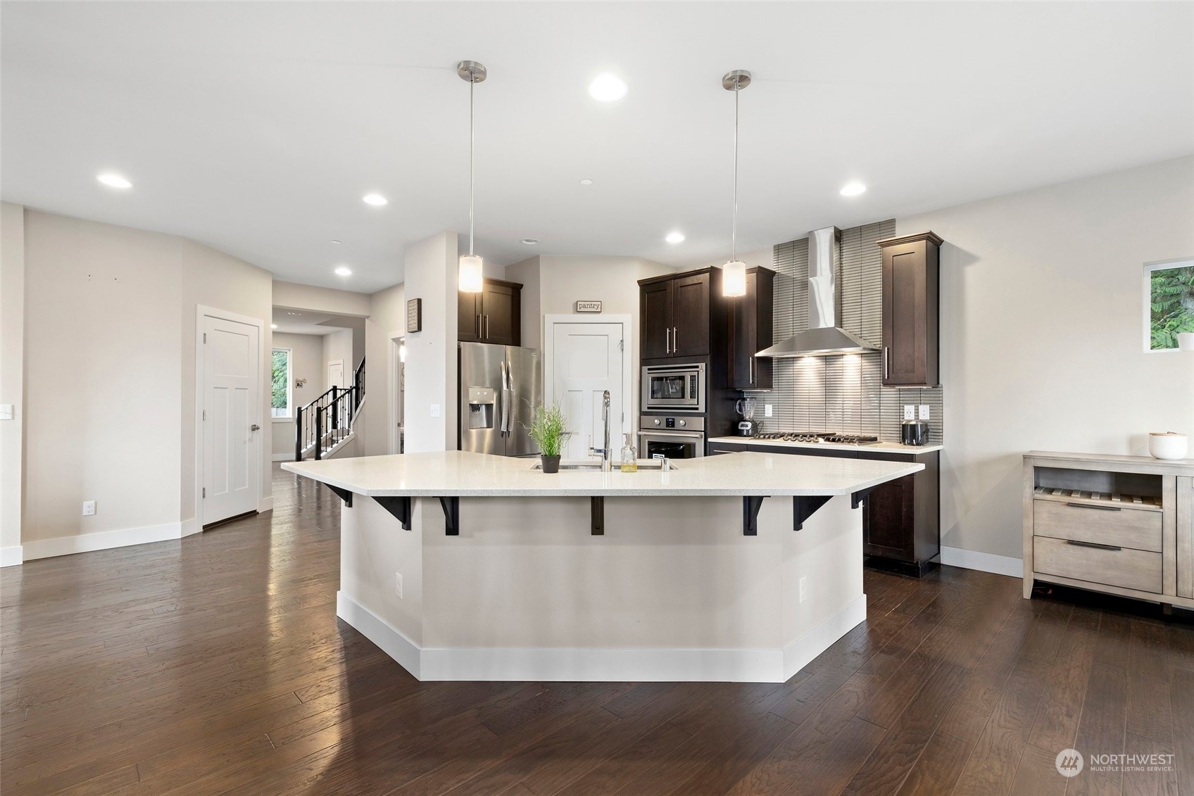 4206 223rd Place Southeast Bothell, WA 98021 - Photo 8 of 40 a large kitchen with kitchen island a sink counter top space and stainless steel appliances