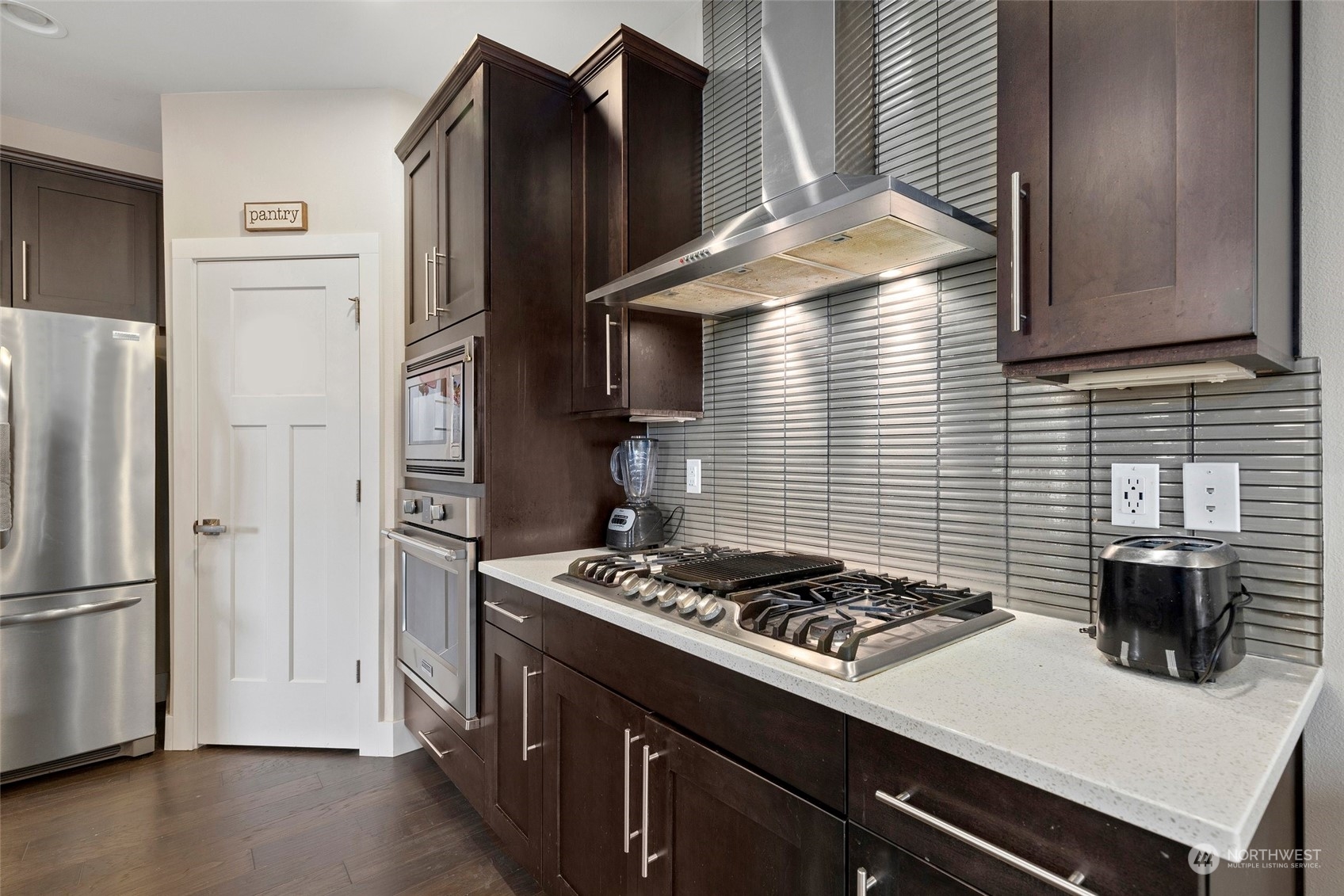 4206 223rd Place Southeast Bothell, WA 98021 - Photo 9 of 40 a kitchen with a stove and a refrigerator