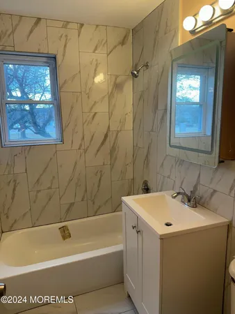 a bathroom with a sink and a bathtub