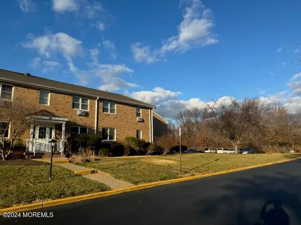 a view of house with yard