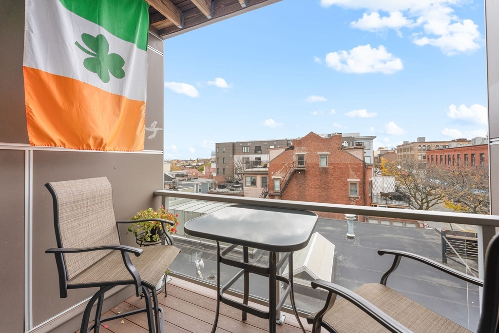 380 West Broadway, Unit 401 Boston, MA 02127 - Photo 11 of 25 a view of a chairs and table in the terrace
