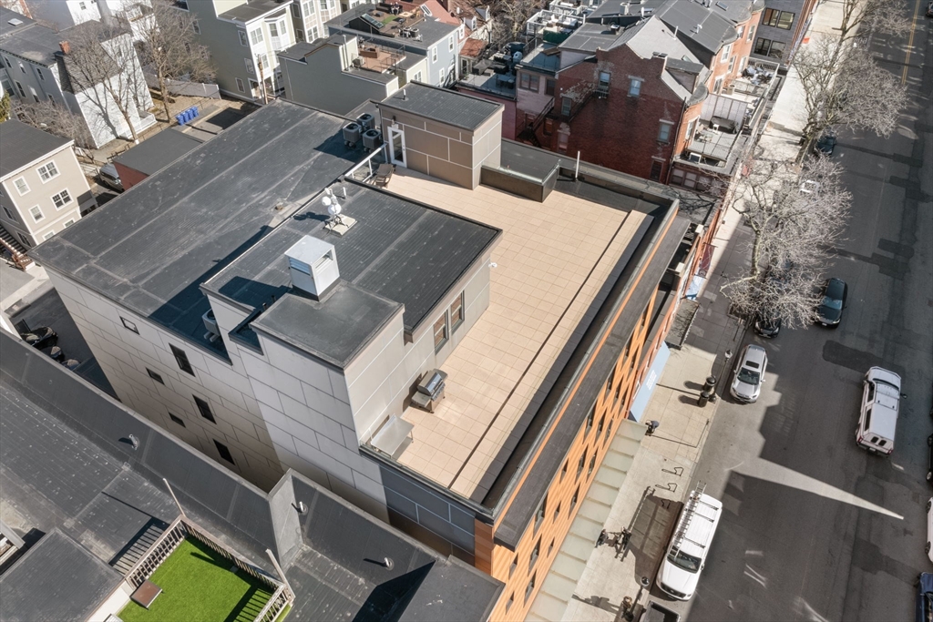 380 West Broadway, Unit 401 Boston, MA 02127 - Photo 23 of 25 an aerial view of a house with balcony