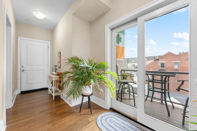 a view of a dining room with furniture window and wooden floor