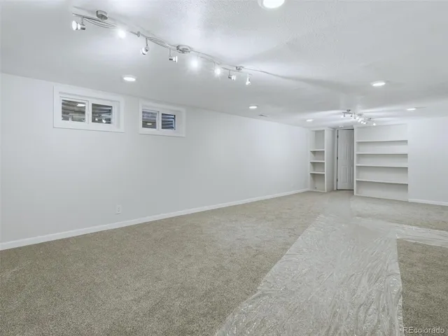 a bathroom with a sink a mirror a bathtub and shower