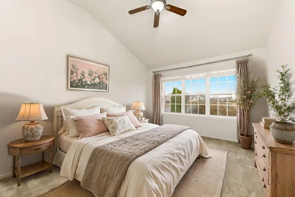 a bedroom with a bed and a window