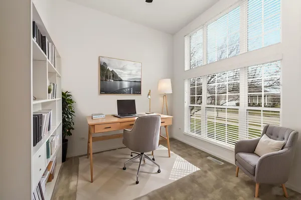 a work room with furniture and windows