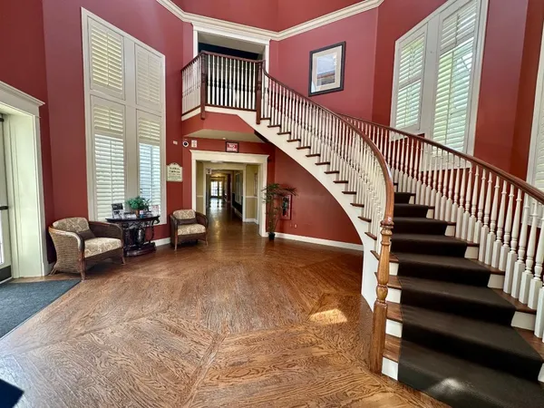 a view of staircase with furniture and stairs